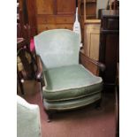 A pair of walnut-framed bergere armchairs, double-caned arms, on front cabriole feet