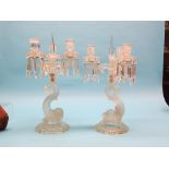 A pair of late Victorian pressed glass candelabra, each with three sconces issuing from frosted