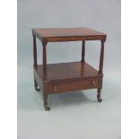 An early 19th century mahogany occasional table, two-tiered with single drawer, on casters, 1ft.