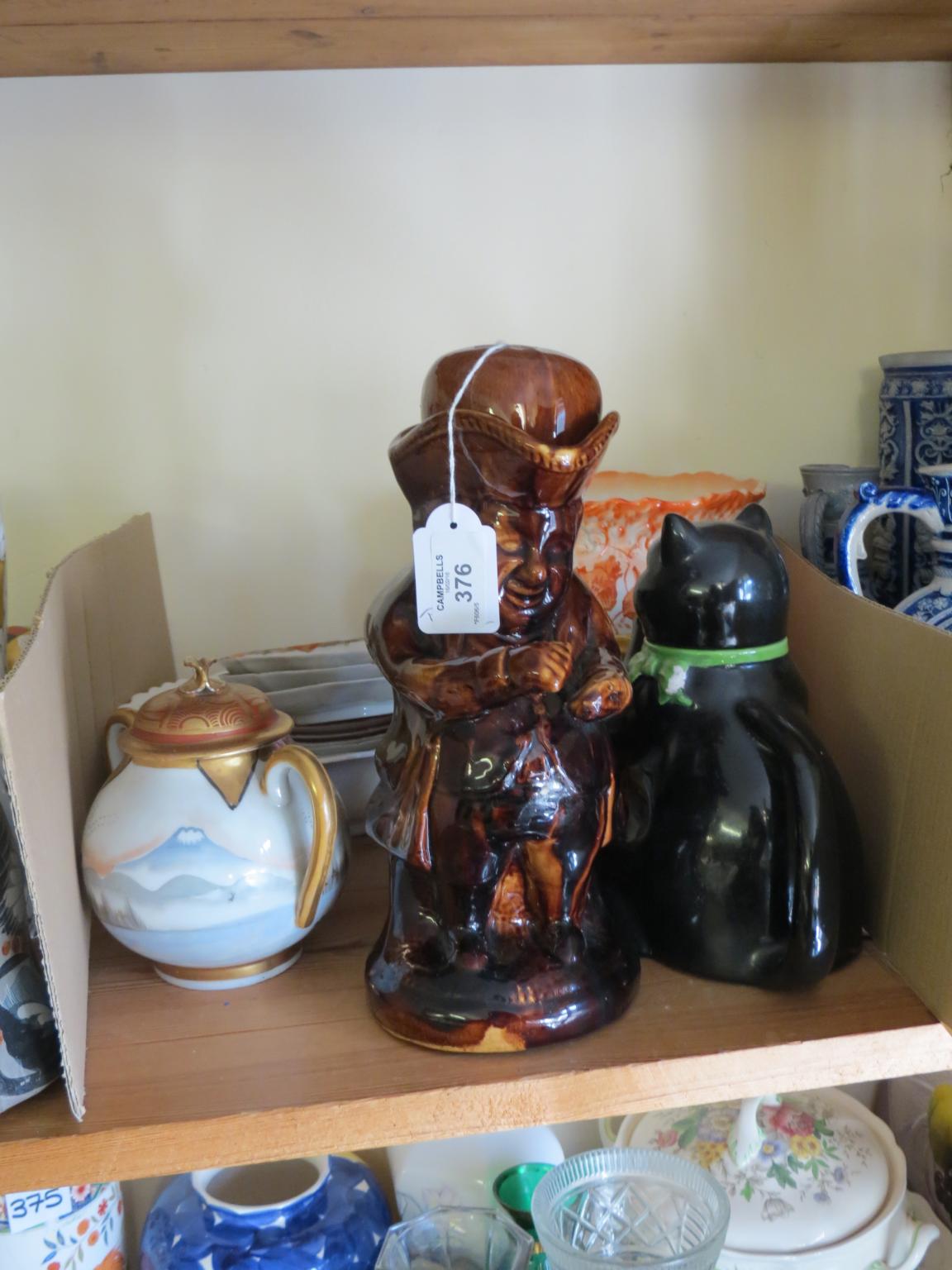 A Victorian treacle-glazed Snuff-taker character jug, with cover, and other china