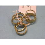 Seven 22ct. gold band wedding rings, 27 grams total