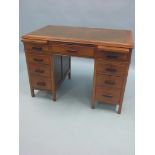 A Victorian walnut desk, inset leather top above three drawers with two brushing slides, three