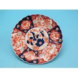 An Imari wall plate, floral-painted in traditional colourse, 14.5in., and another, 16in.