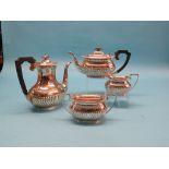 A silver four-piece teaset, teapot, hot water pot, each with hardwood handle, sugar bowl and milk