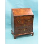 A small, early 18th century walnut-veneered bureau