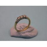 An 18ct. gold and diamond half-hoop ring, three diamonds, size R