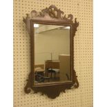 A George II-style mahogany mirror, rectangular with elaborately-shaped cresting and gilded  ho-ho