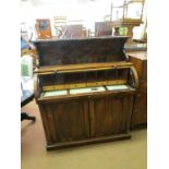 An early Victorian Brazilian rosewood cylinder desk, over-shelf on shaped brackets, cylinder top