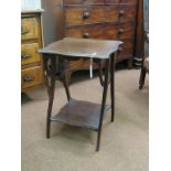 An Edwardian mahogany occasional table, serpentine-shaped top on unusual underframe with lower tier,