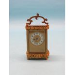 An early 20th century French brass carriage clock, with enamelled chapter ring and timepiece