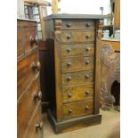 A Victorian walnut Wellington chest, seven graduated drawers, each with turned wood knob handles,