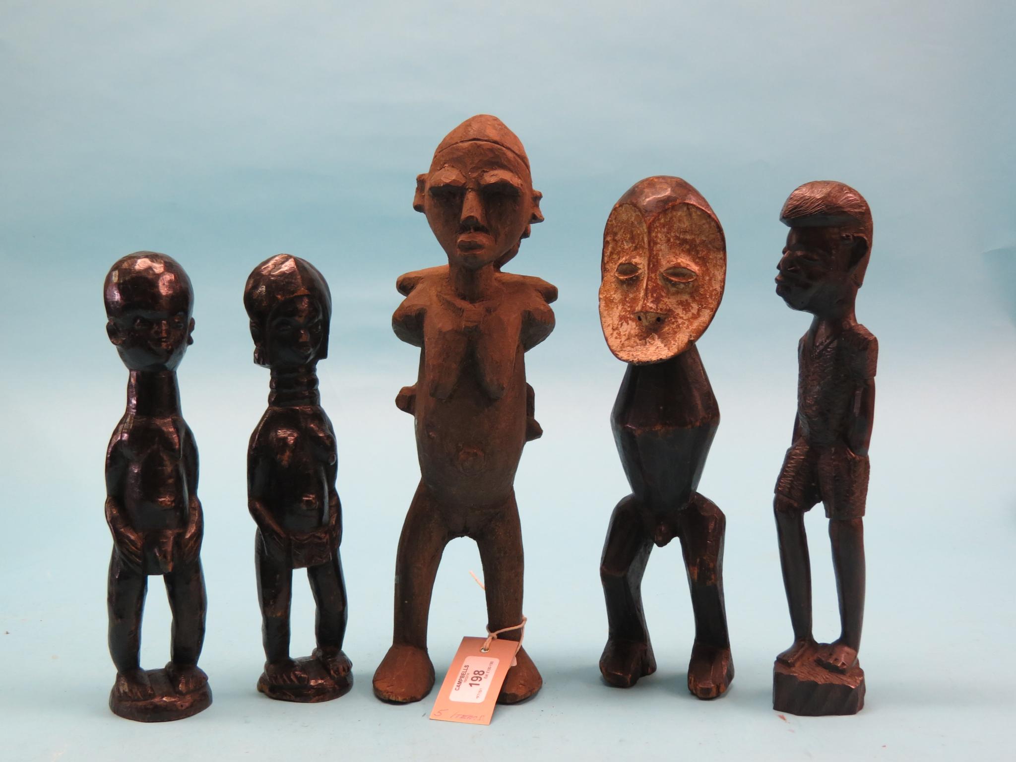Five African tribal wood-carvings, male and female forms, tallest 13in.