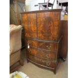 A bow-fronted mahogany linen cupboard, pair of doors enclosing single shelf, three long oak-lined