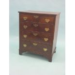 A small, late Victorian mahogany chest, four long cock-beaded drawers, shaped brass handles and