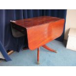 A George III mahogany drop-leaf breakfast table, with opposing frieze drawers, on tapering