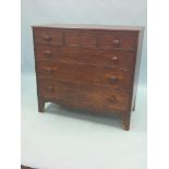 An early 19th century inlaid mahogany chest, three short and three long graduated drawers,