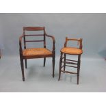 A Sheraton-period mahogany elbow chair, with cane seat, on front turned legs, and a child's cane-