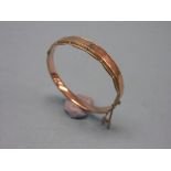 A 9ct. gold bangle, 10.8 grams