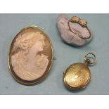 A Victorian cameo brooch, oval-shape within yellow metal mount, a yellow metal ring, claw-set with