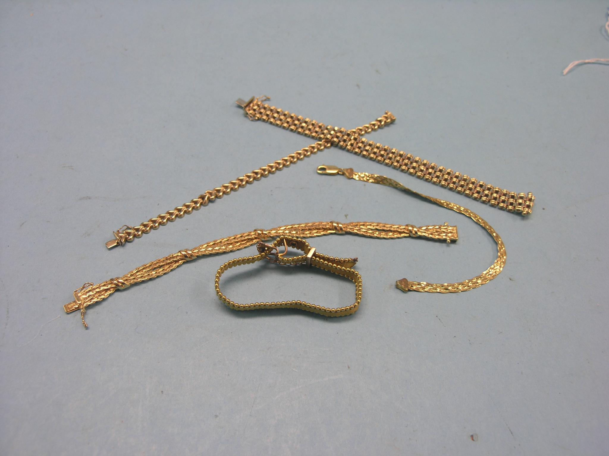 Five various 9ct. gold bracelets, 71.4 grams total