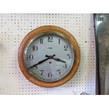 A Victorian dial clock, 9.5in. silvered dial and oak surround, with key