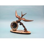 An Art Deco-style mantel clock, circular dial signed Silvoz, Paris, cast metal bird design with