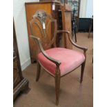 An Edwardian Hepplewhite elbow chair, shield-shape back and upholstered seat, frame painted with