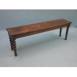 A Victorian dark oak hall bench, on barley-twist legs, 4ft. 8in. - top stained