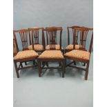 A set of six 19th century Chippendale mahogany dining chairs, camel-backs with pierced splats,