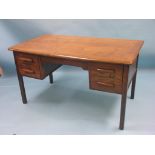 A dark oak office desk, polished top above four short drawers, 4ft. 6in., together with a large