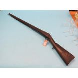 A 19th century percussion cap rifle, single-barrelled with walnut stock and ram-rod, 16mm bore,