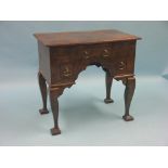 A Georgian-style oak and walnut kneehole desk, three short drawers, on four cabriole legs, 2ft.