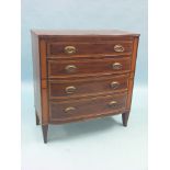 An early 19th century inlaid mahogany chest, four graduated drawers, each with oval, pressed brass