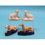 A pair of early Victorian bone china sheep models, each recumbent on cushion base, 3.5in. high,