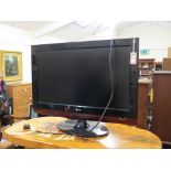 An LG flatscreen television, 32LG4000, 32in. screen with remote control