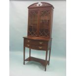 A late Victorian mahogany bookcase, pair of astragal-glazed doors enclosing two shelves,