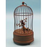 A late 19th century singing bird automaton, in the form of a domed circular bird-cage, two