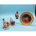 A 19th century Vienna-style cabinet plate, painted with a maternal cherub scene, gilded ivory