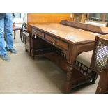 A Victorian walnut writing table, with two ash-lined frieze drawers, brass acorn-drop handles, on