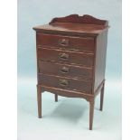 An Edwardian mahogany music chest, four fall-front drawers, 1ft. 8in.