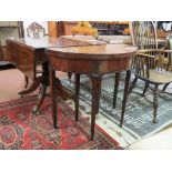 A George III mahogany tea table, half-round, two rear legs supporting folding leaf, recess enclosed,