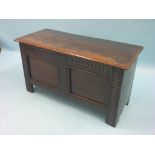 An early 18th century oak coffer, panelled front with carved detail, 3ft. 4in. - repairs include