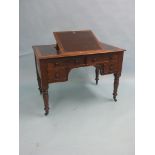 A Victorian mahogany desk, inset vinyl top with adjustable slope, kneehole arrangement of four oak-