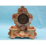 An early 20th century earthenware clock garniture, rococo-style clock, 16in. wide, pair of two-