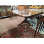 A late George III mahogany drop-leaf breakfast table, with two oak-lined frieze drawers, turned