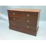 A late Victorian walnut chest, two short and two long drawers, replacement oval, pressed brass