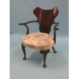 A George I-style mahogany elbow chair, shaped back and open arms, upholstered seat on front cabriole