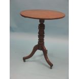 A Victorian oak tripod table, circular top on turned stem, unusual with casters, 2ft.