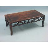 A Chinese rosewood-family coffee table, rectangular top above open scroll frieze, 2ft. 6in.