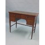 A late Victorian inlaid mahogany writing desk, inset tooled leather top above a kneehole arrangement